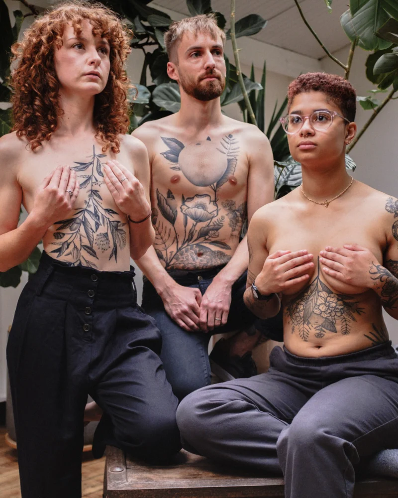 Freehand botanical tattoo across the front torso