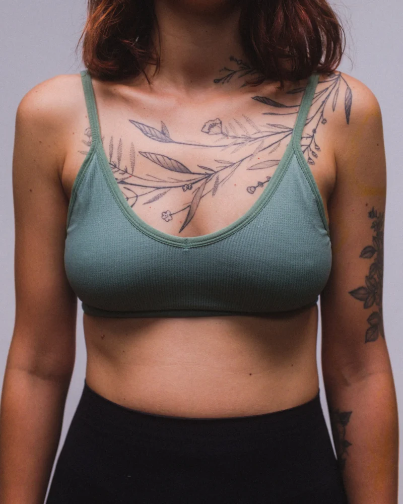 Freehand botanical tattoo across the front torso